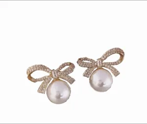 "Elegance in Every Detail: 18K Gold Plated Bow Stud Earrings with Rhinestone and Pearl Accents  Sophisticated Women's Jewelry and Accessories"