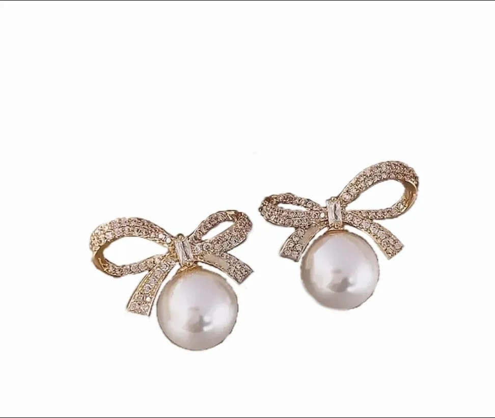 "Elegance in Every Detail: 18K Gold Plated Bow Stud Earrings with Rhinestone and Pearl Accents  Sophisticated Women's Jewelry and Accessories"